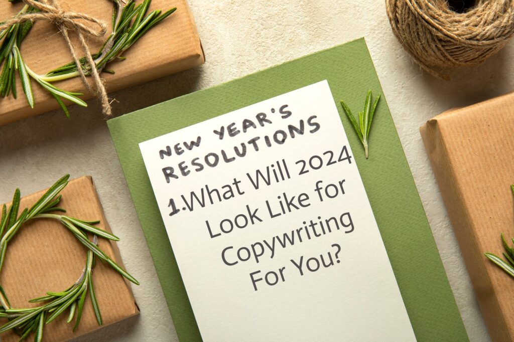 Notebook on desk reads: New Year's Resolutions: What will 2024 look like for Copywriting For You?