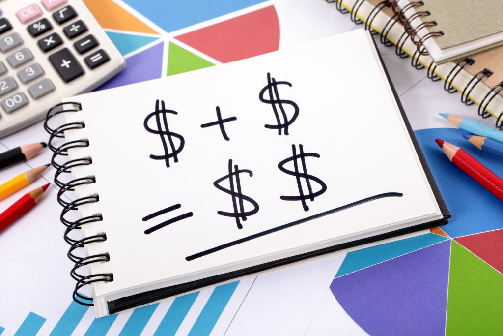 Notebook with dollar signs represents pricing strategy Image by kstudio on Freepik