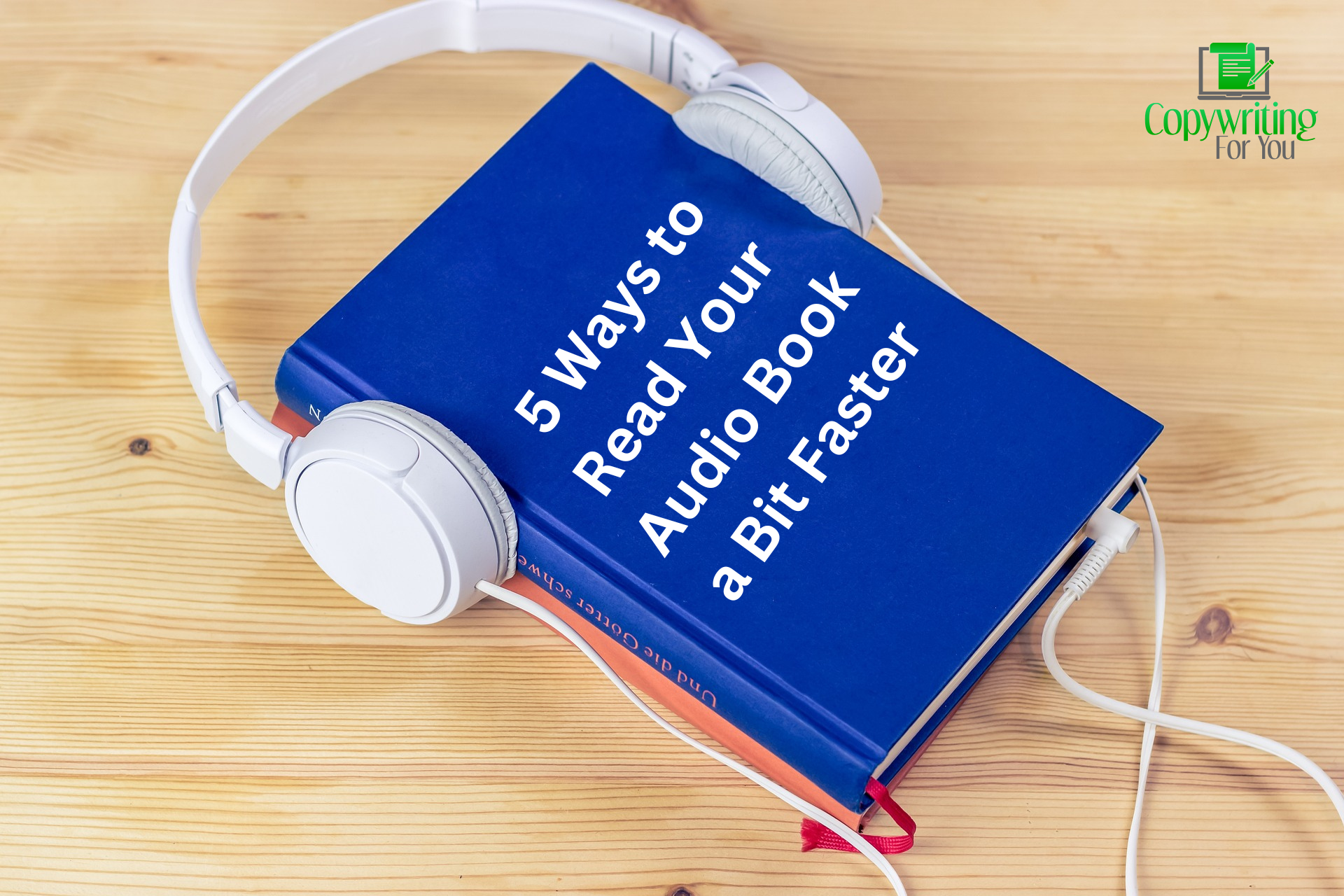 Image of a book with headphones on it, implying an audiobook.