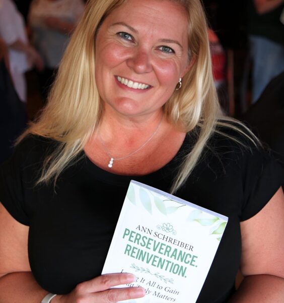 Ann Schreiber - Headshot with Book